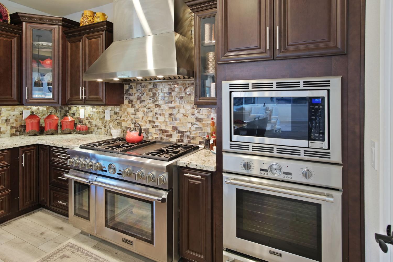 3205 Hillglen Avenue Modesto, CA 95355 - Photo 14 of 45 a stove top oven sitting inside of a kitchen