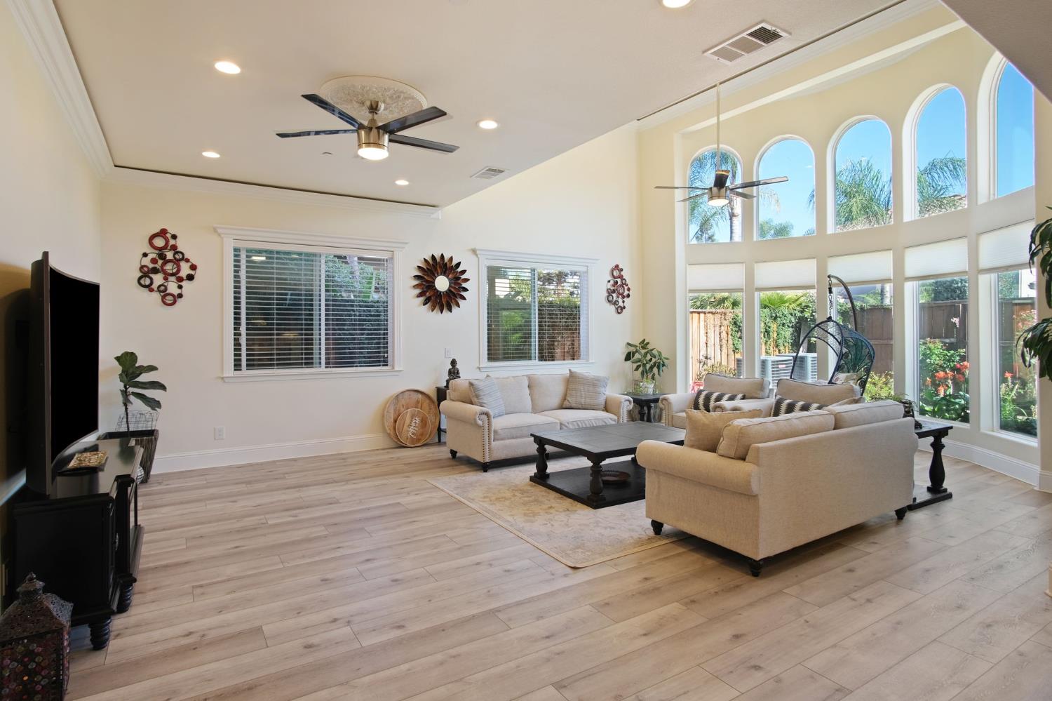 3205 Hillglen Avenue Modesto, CA 95355 - Photo 16 of 45 a living room with furniture window and a flat screen tv