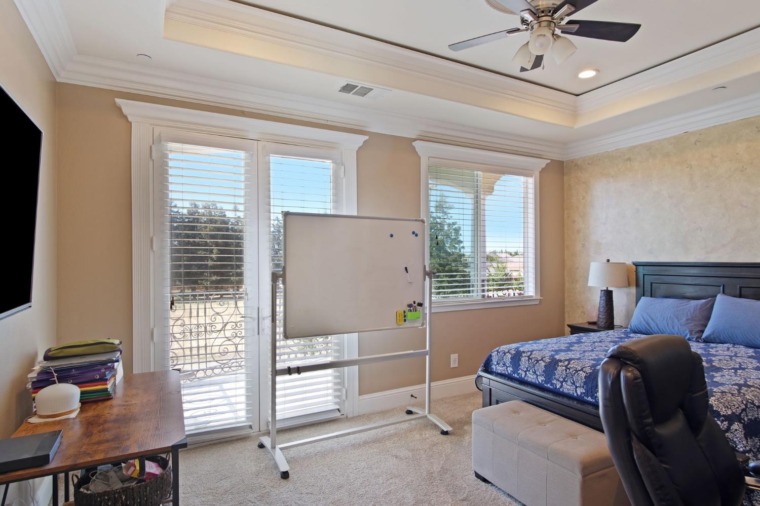 3205 Hillglen Avenue Modesto, CA 95355 - Photo 37 of 45 a bedroom with a bed and a window