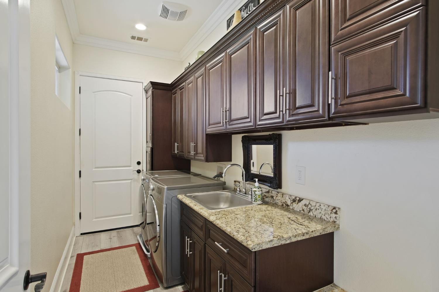 3205 Hillglen Avenue Modesto, CA 95355 - Photo 39 of 45 a kitchen with a sink stove and cabinets