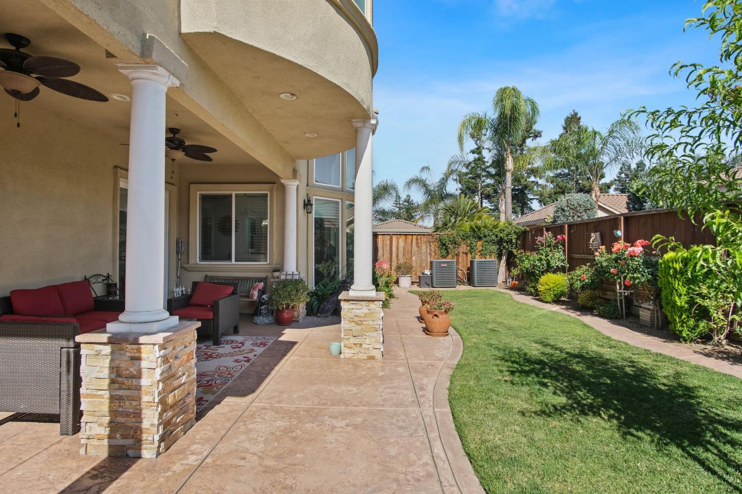 3205 Hillglen Avenue Modesto, CA 95355 - Photo 40 of 45 a view of a patio with couches table and chairs and potted plants