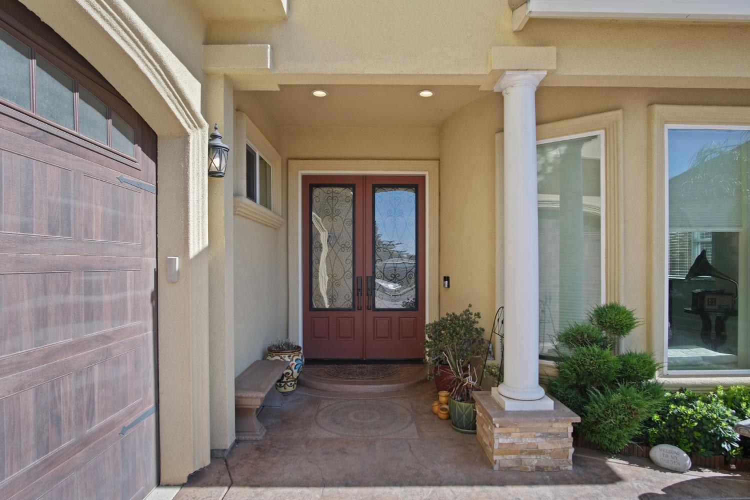 3205 Hillglen Avenue Modesto, CA 95355 - Photo 4 of 45 a view of an entryway with a flower garden
