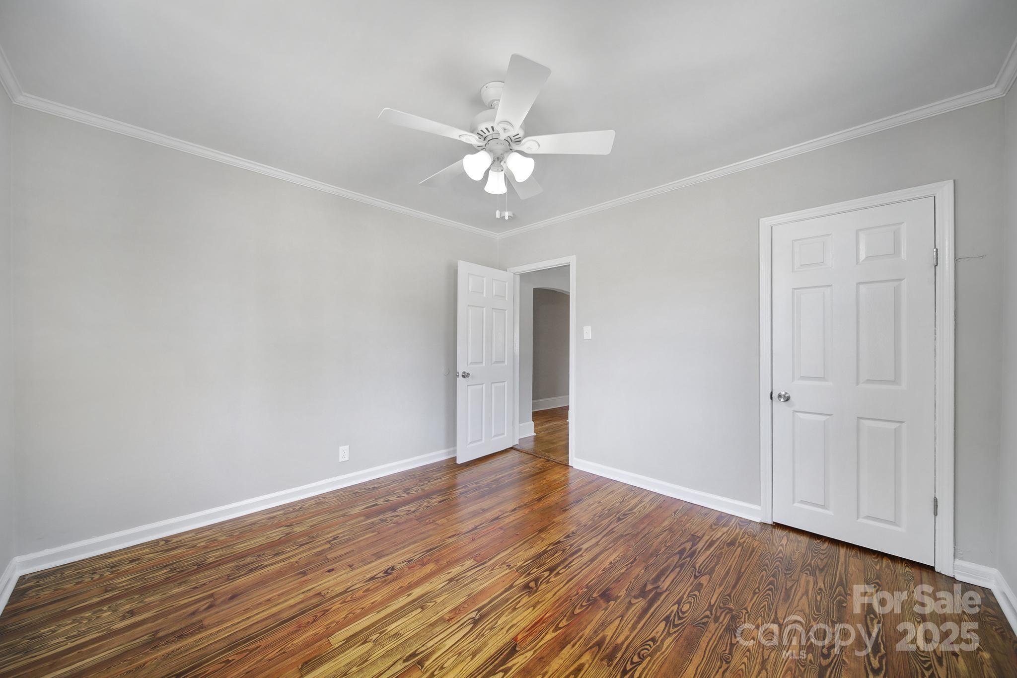 744 Cauthen Street Rock Hill, SC 29730 - Photo 11 of 28 an empty room with wooden floor fan and windows