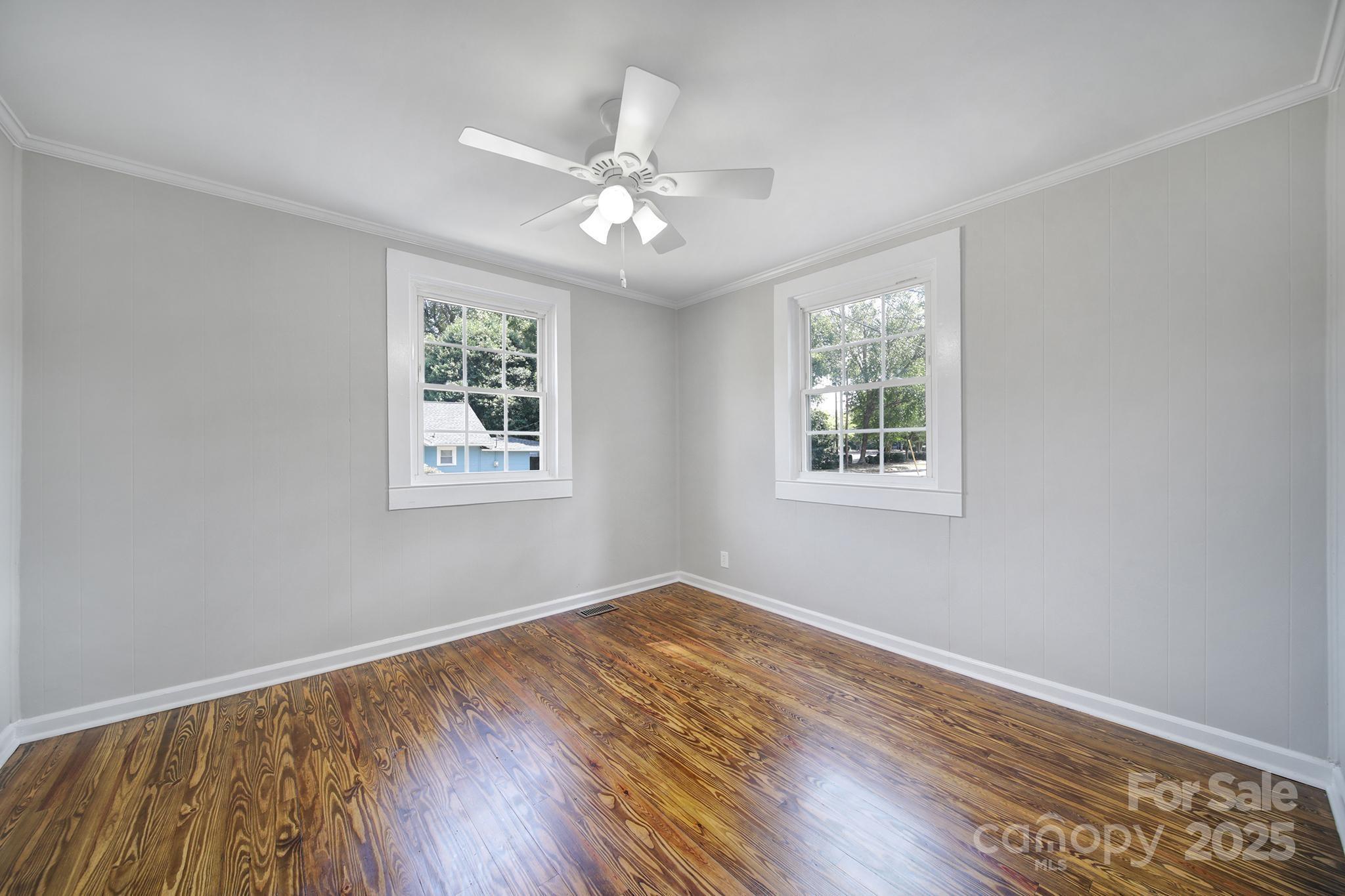 744 Cauthen Street Rock Hill, SC 29730 - Photo 14 of 28 a view of an empty room with wooden floor and a window
