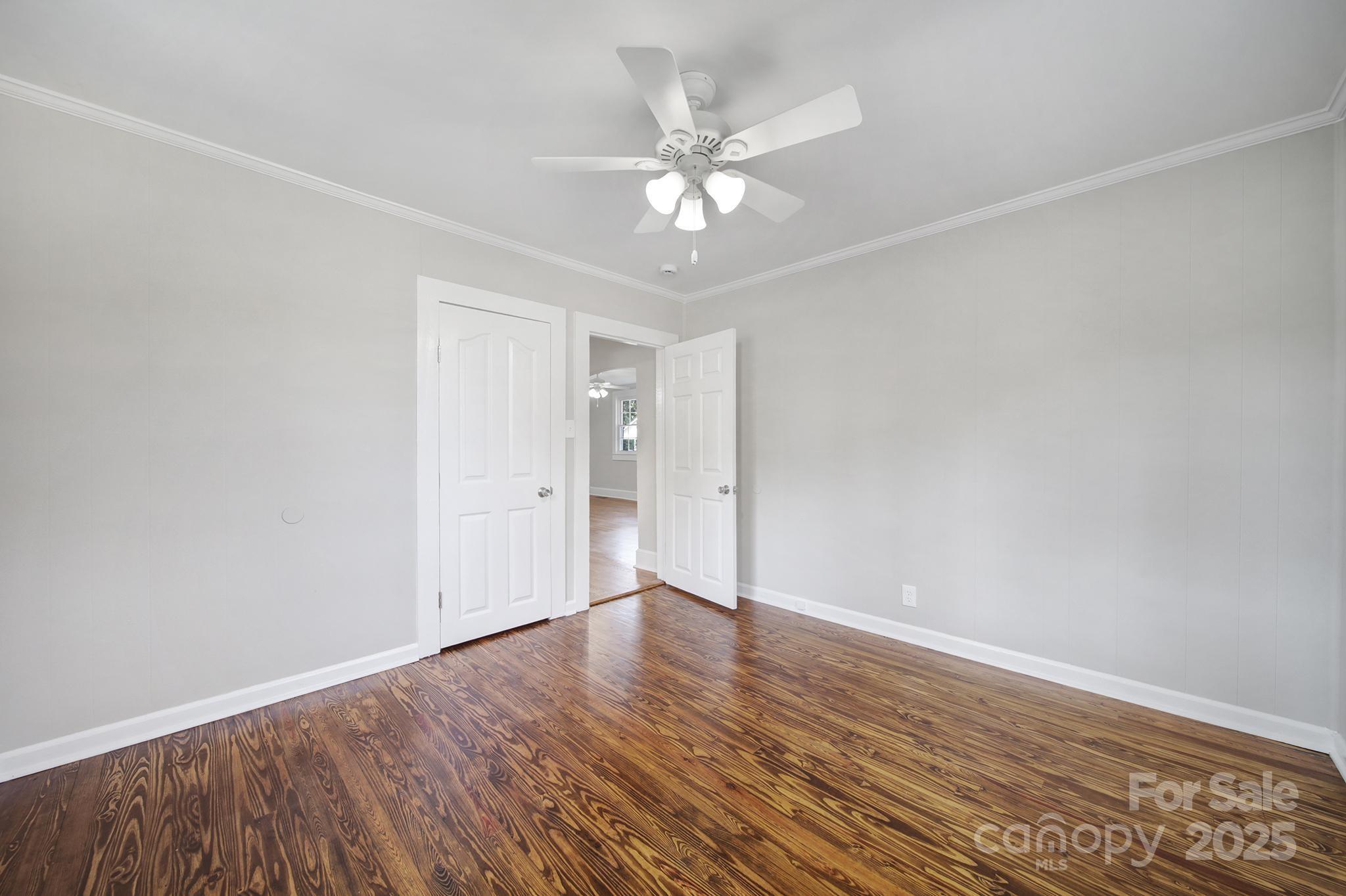 744 Cauthen Street Rock Hill, SC 29730 - Photo 15 of 28 an empty room with wooden floor and fan