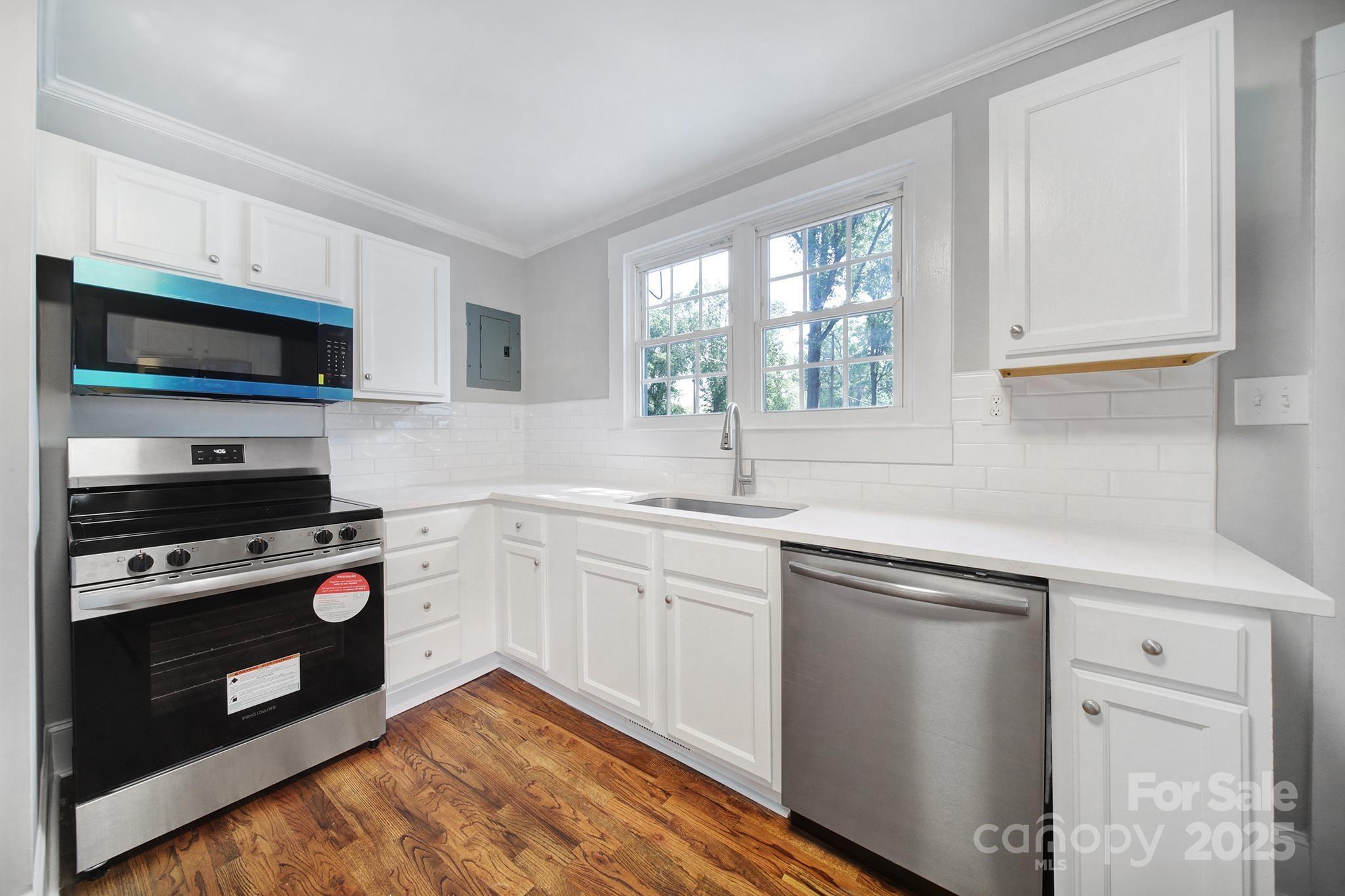 744 Cauthen Street Rock Hill, SC 29730 - Photo 20 of 28 a kitchen with a sink stove and microwave