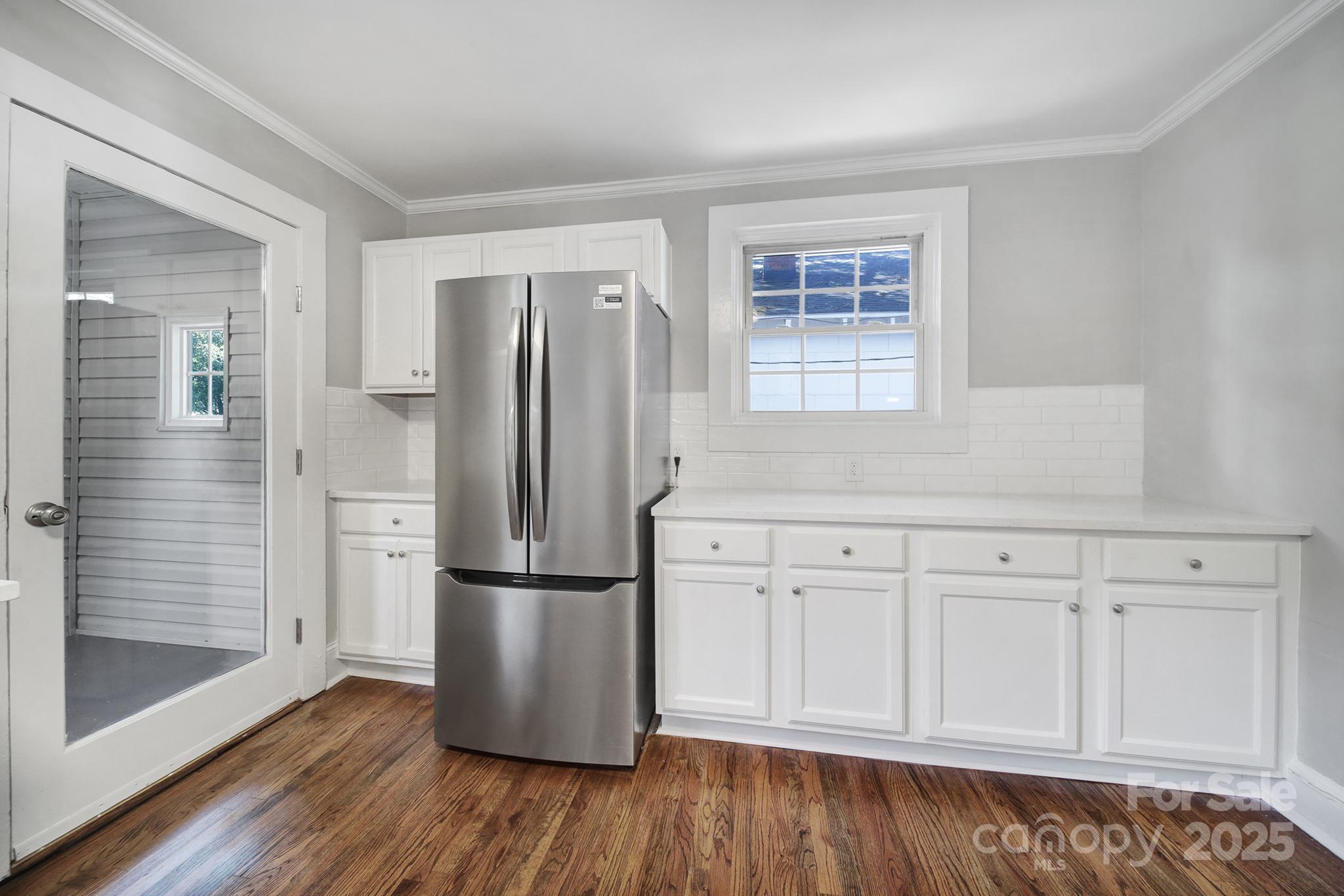 744 Cauthen Street Rock Hill, SC 29730 - Photo 22 of 28 a kitchen with appliances wooden floor and a window