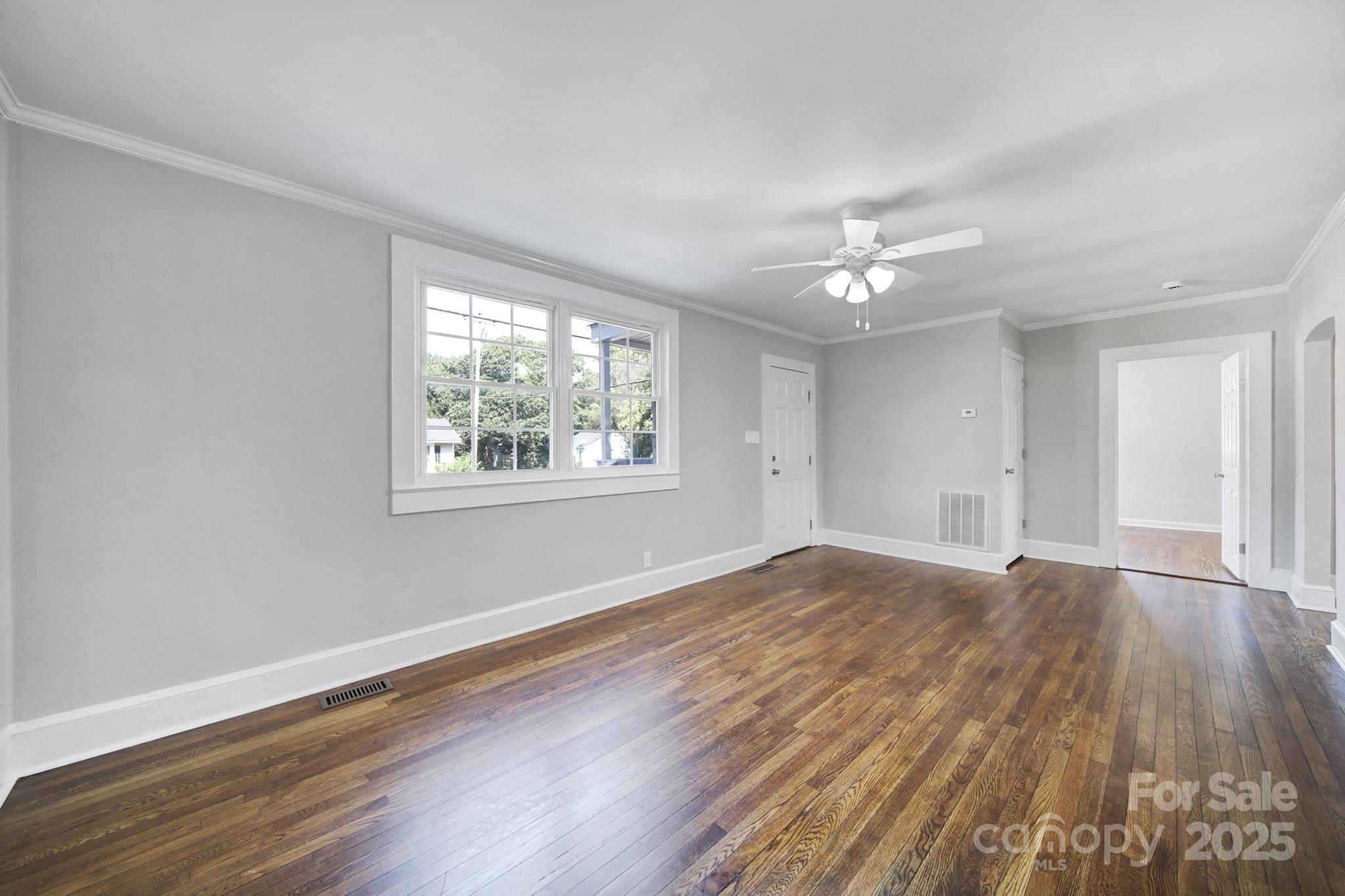 744 Cauthen Street Rock Hill, SC 29730 - Photo 9 of 28 a view of empty room with wooden floor and fan