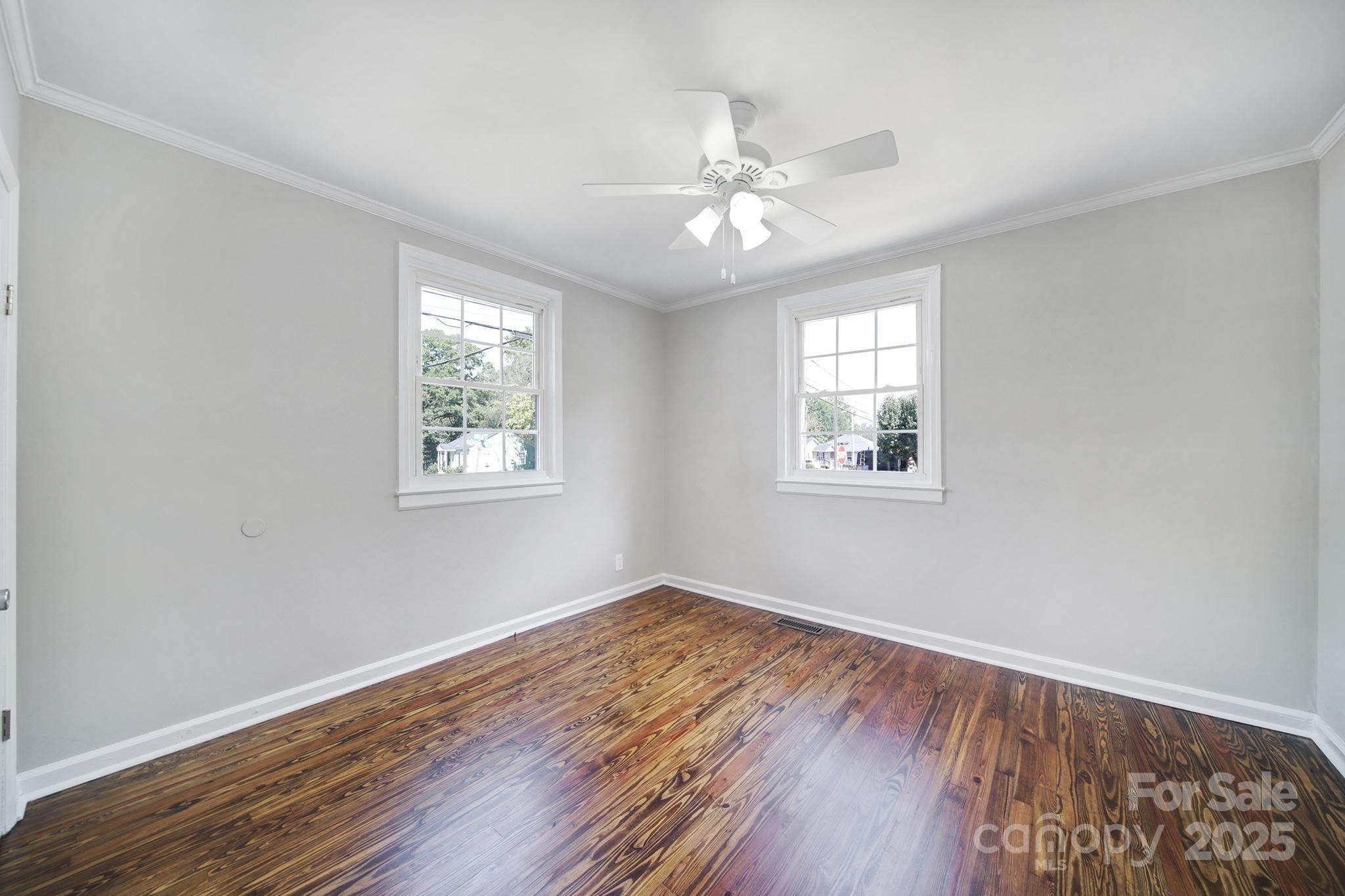 744 Cauthen Street Rock Hill, SC 29730 - Photo 10 of 28 a view of an empty room with wooden floor and a window