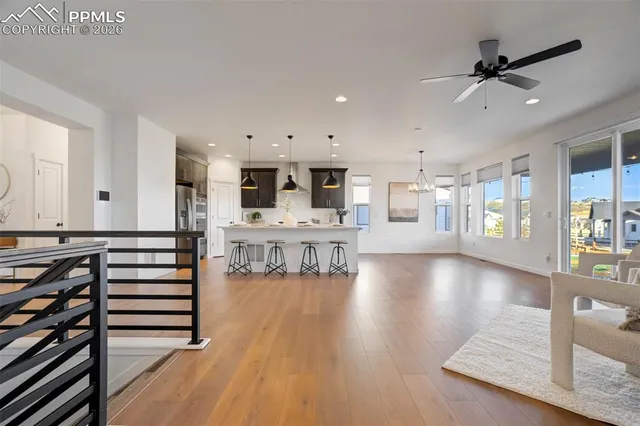 a view of a living room kitchen and dining room