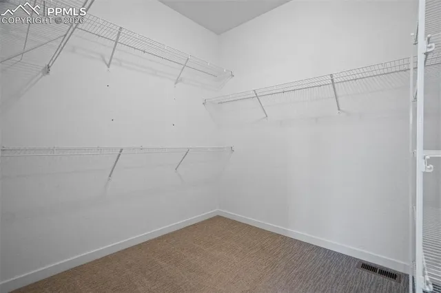 a view of room with window and hallway