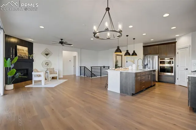 a view of a kitchen with cabinets and wooden floor