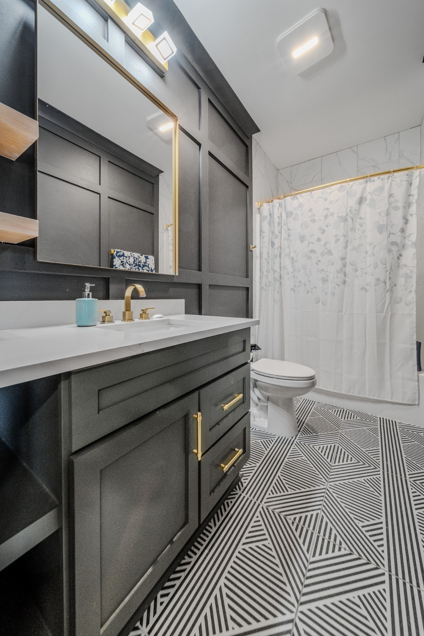 832 Blakemore Road Dickson, TN 37055 - Photo 18 of 42 a spacious bathroom with a granite countertop sink a toilet a mirror and shower
