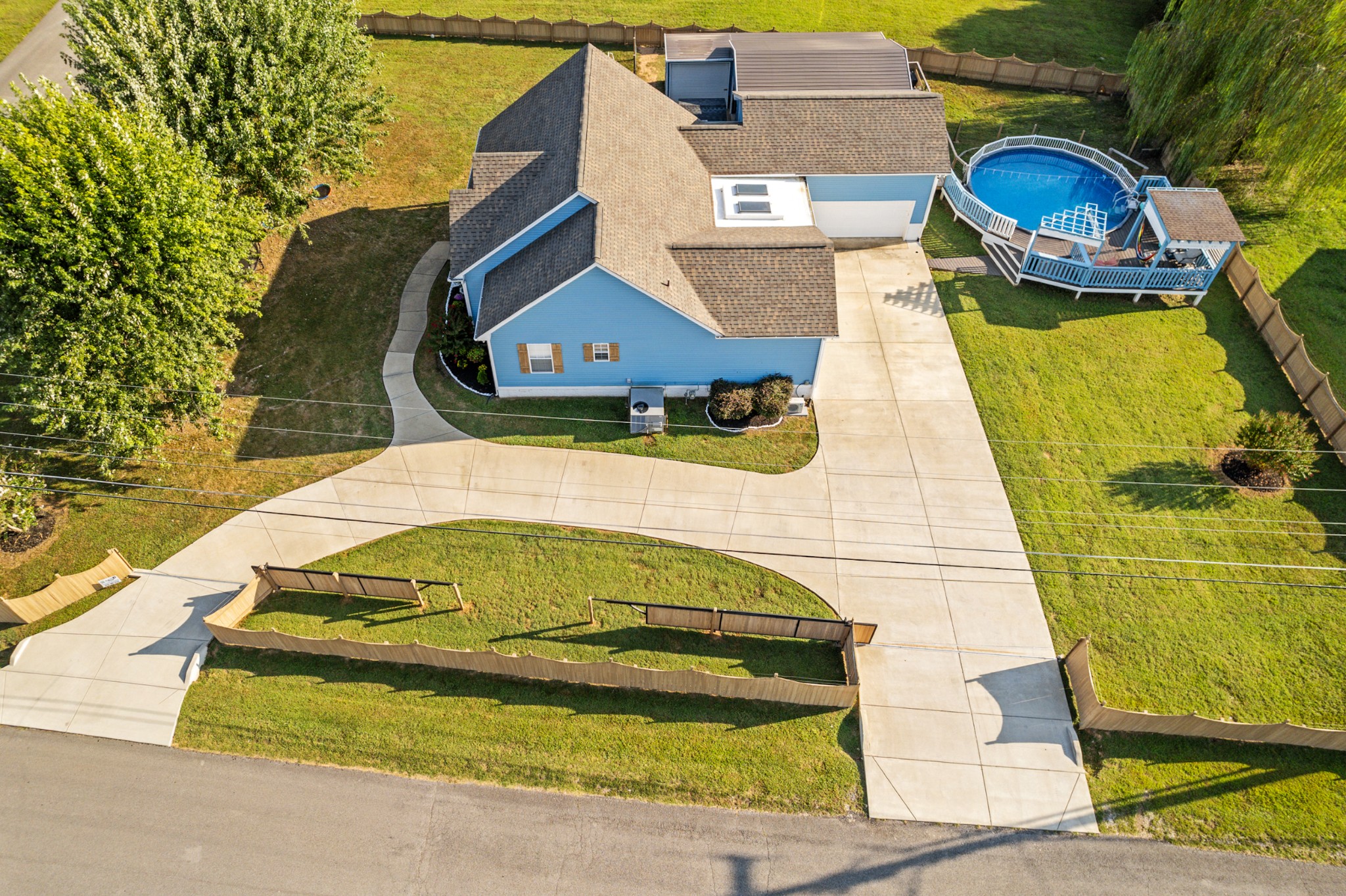 832 Blakemore Road Dickson, TN 37055 - Photo 40 of 42 an aerial view of a house with a swimming pool