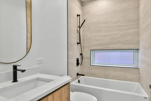 a bathroom with a sink and a bathtub
