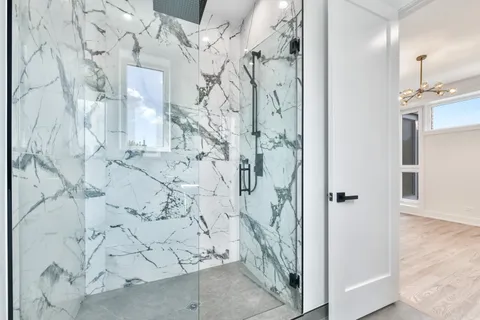 a bathroom with a bathtub and shower