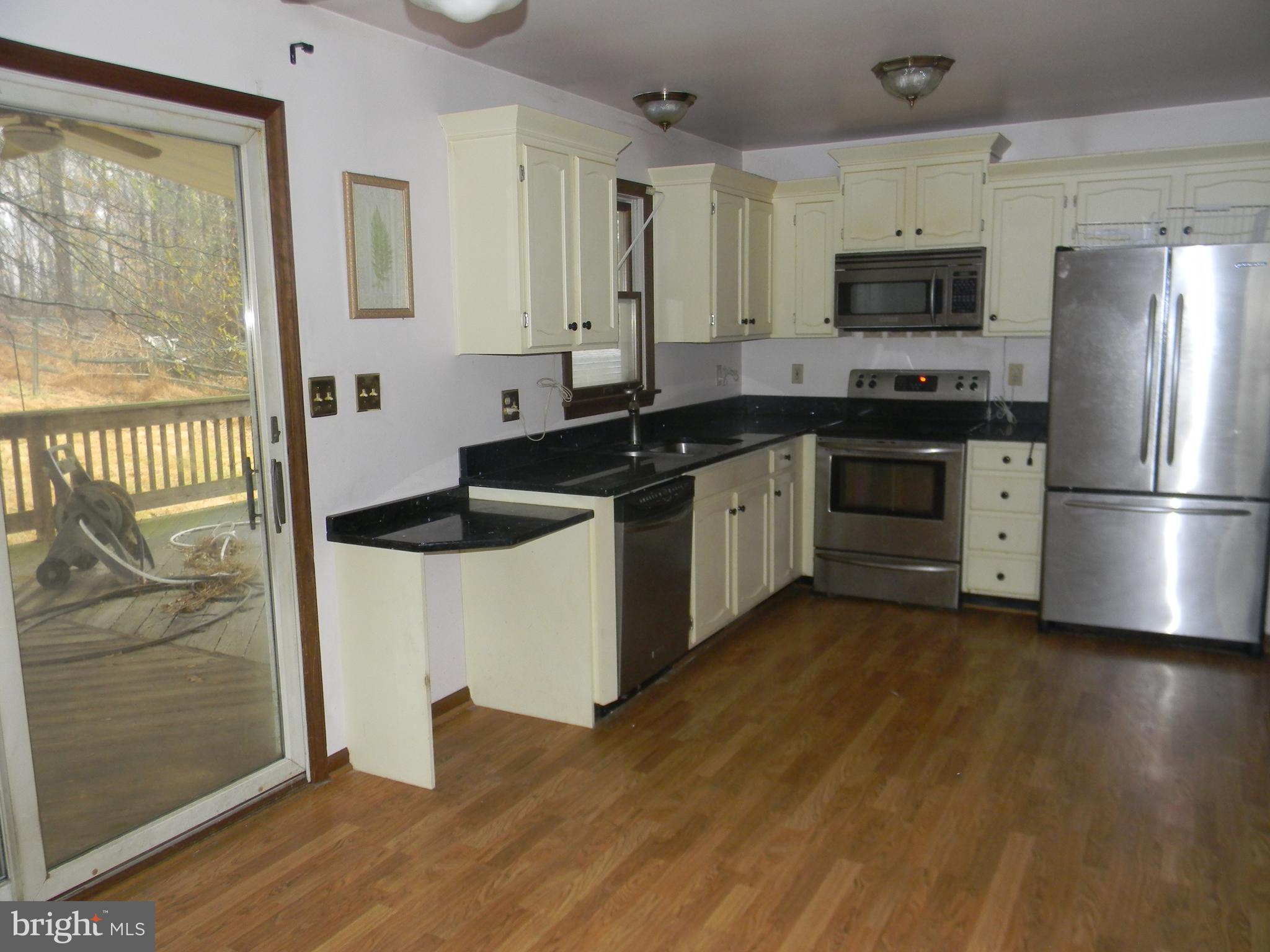 14902 Falls Road Reisterstown, MD 21136 - Photo 6 of 34 KITCHEN W/ TABLE SPACE & SS APPLIANCES