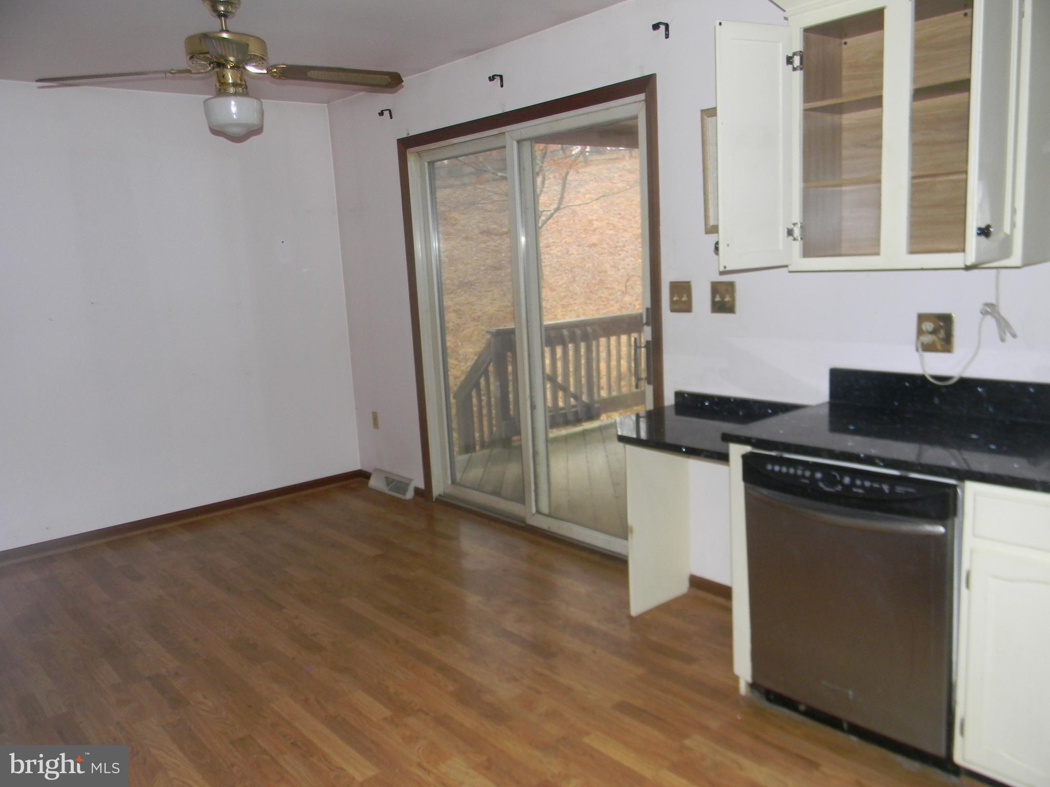 14902 Falls Road Reisterstown, MD 21136 - Photo 9 of 34 KITCHEN W/ WALK OUT TO COVERED DECK