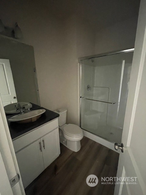 2812 Laurel Loop Milton, WA 98354 - Photo 5 of 11 a bathroom with a granite countertop sink toilet and shower