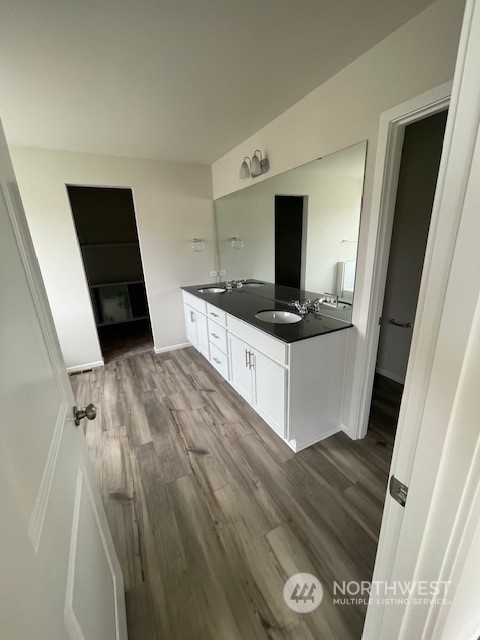 2812 Laurel Loop Milton, WA 98354 - Photo 8 of 11 a kitchen with granite countertop a sink and a stove top oven