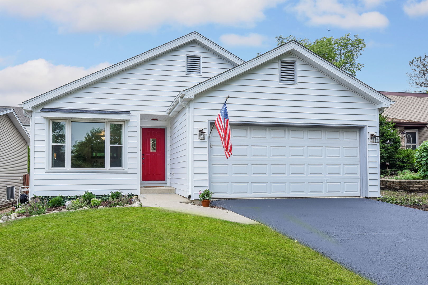 N020 Pleasant Hill Road Wheaton, IL 60187 - Photo 1 of 16 a view of a house with a small yard and a large window