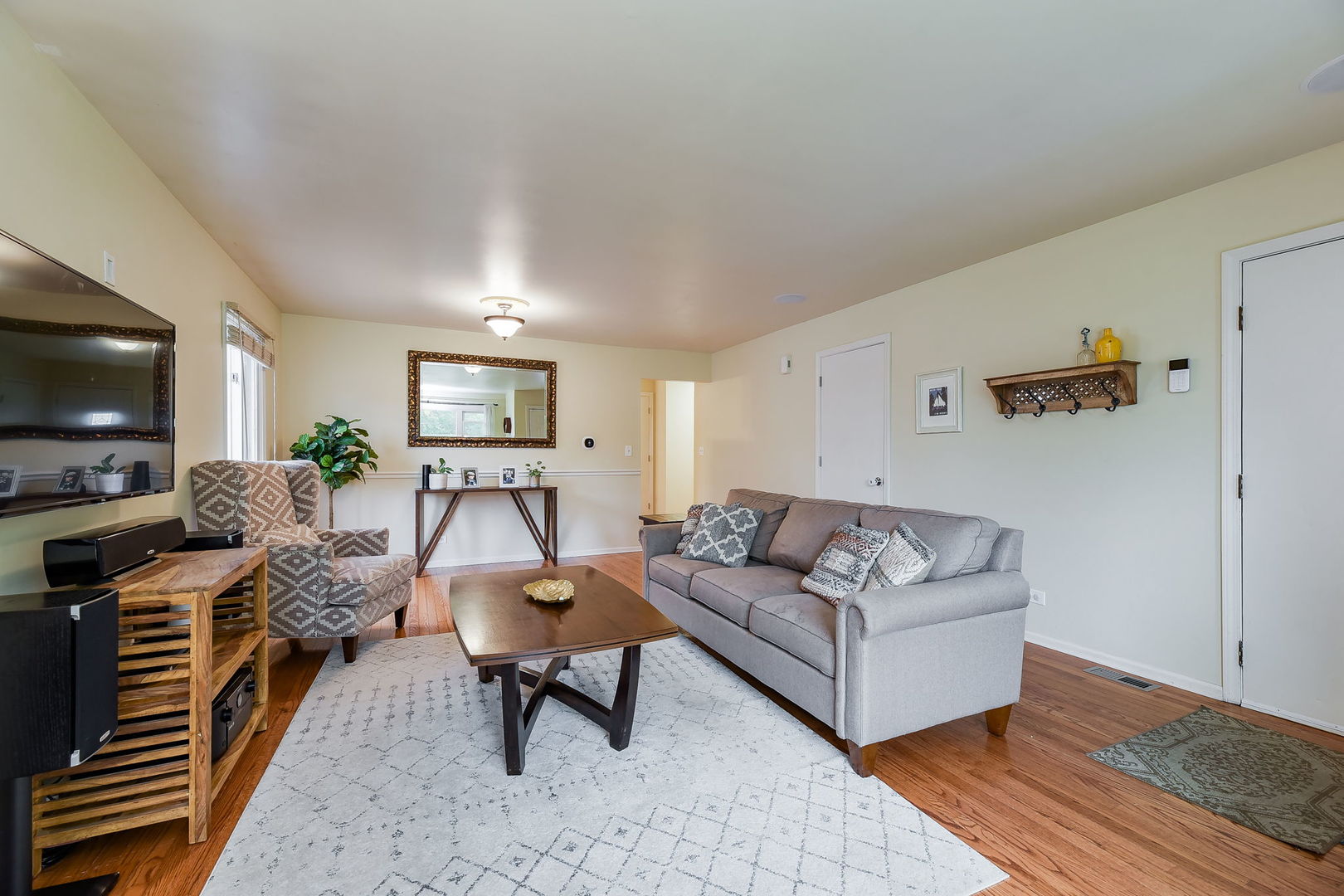 N020 Pleasant Hill Road Wheaton, IL 60187 - Photo 2 of 16 a living room with furniture and a flat screen tv