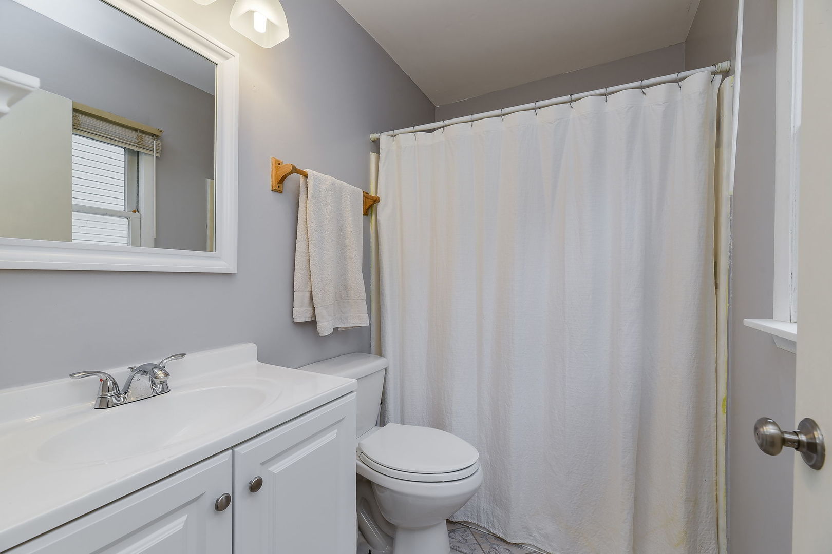 N020 Pleasant Hill Road Wheaton, IL 60187 - Photo 11 of 16 a bathroom with a sink toilet and a mirror