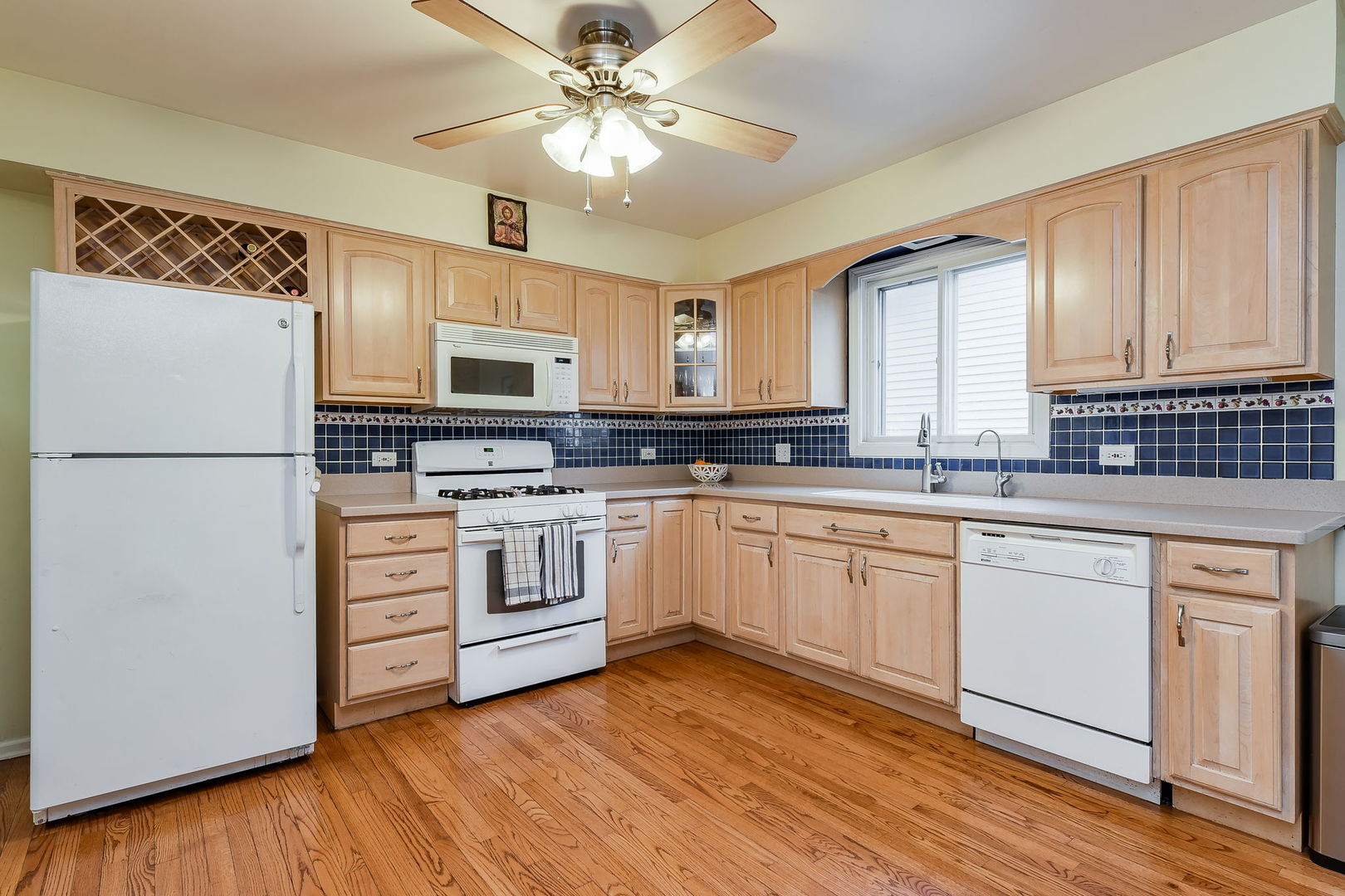 N020 Pleasant Hill Road Wheaton, IL 60187 - Photo 4 of 16 a kitchen with stainless steel appliances a stove a sink and a refrigerator
