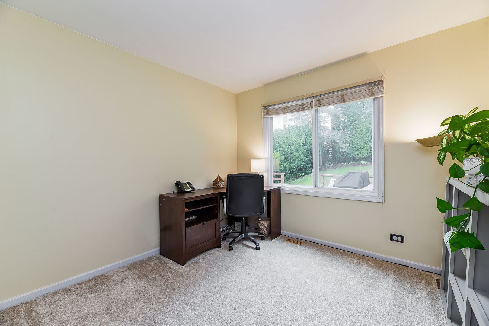 N020 Pleasant Hill Road Wheaton, IL 60187 - Photo 9 of 16 a view of a workspace with furniture and a window