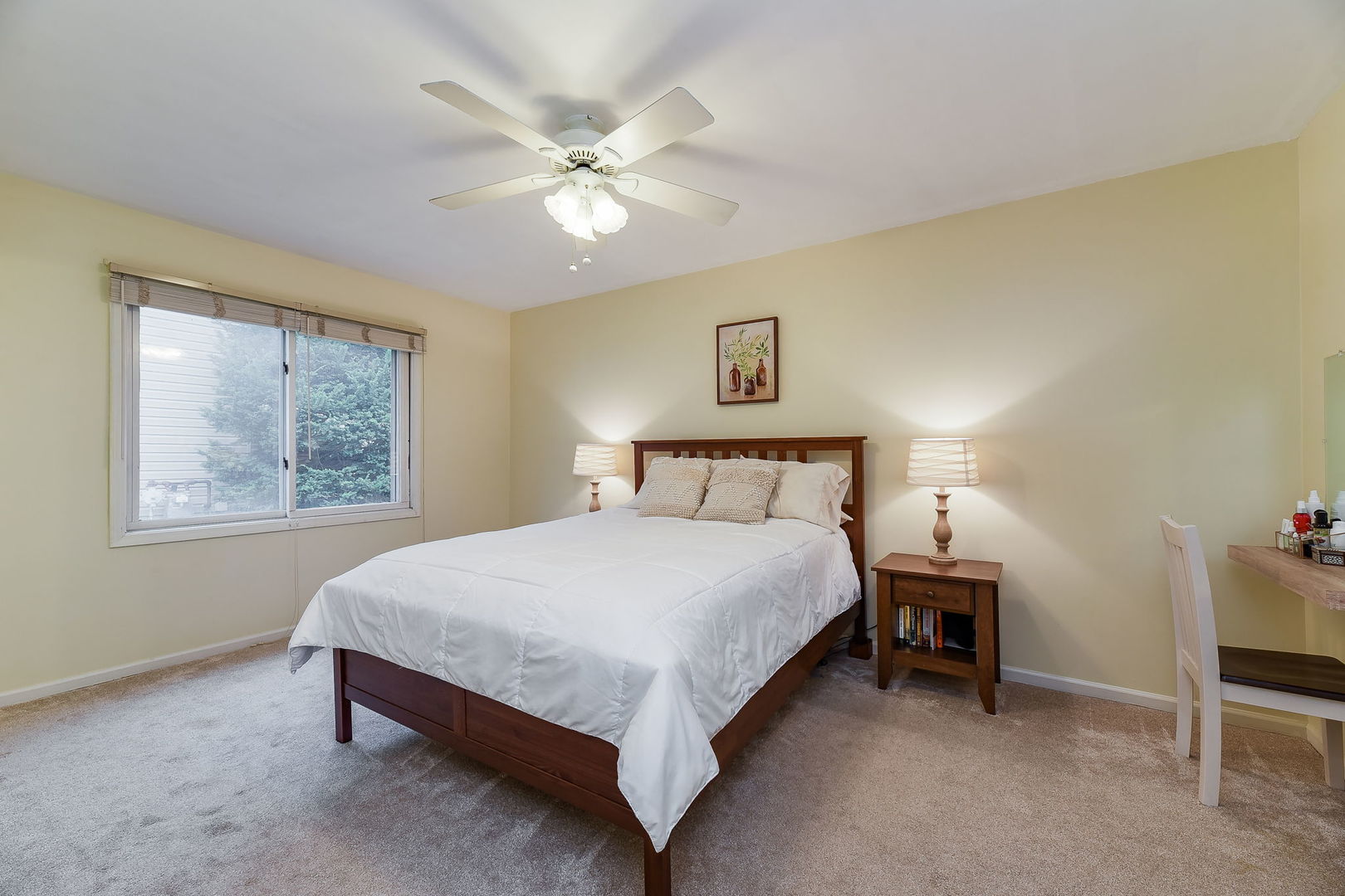N020 Pleasant Hill Road Wheaton, IL 60187 - Photo 10 of 16 a bedroom with a bed and a chandelier
