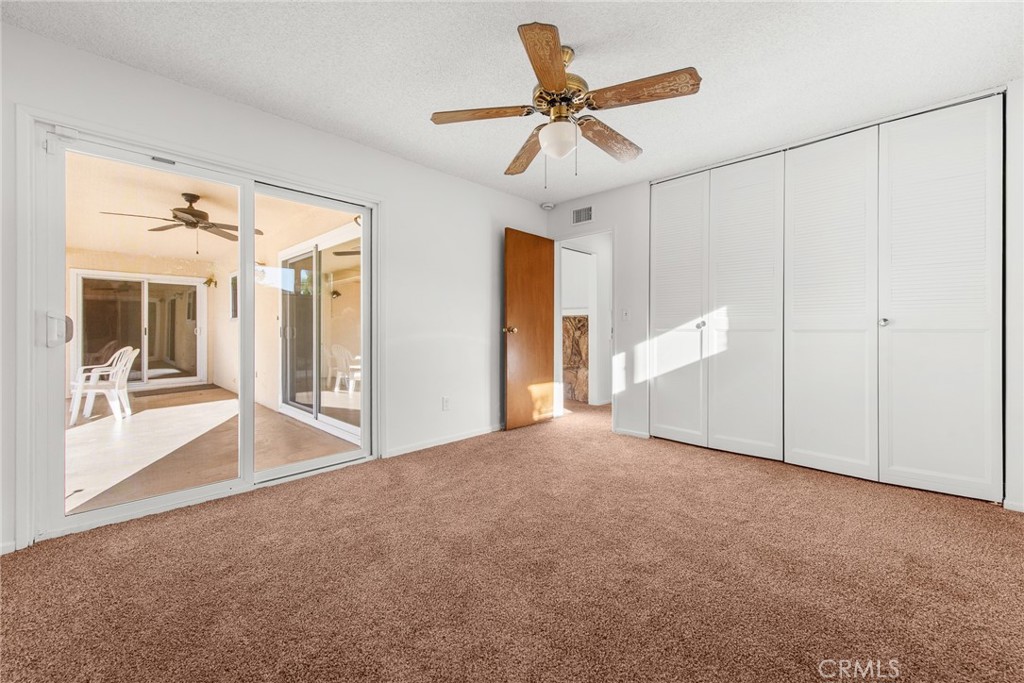 5593 Malvern Way Riverside, CA 92506 - Photo 15 of 54 a view of a livingroom with a ceiling fan and window