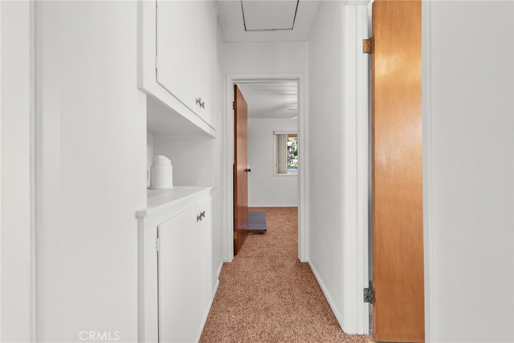 5593 Malvern Way Riverside, CA 92506 - Photo 17 of 54 a view of a hallway with wooden floor