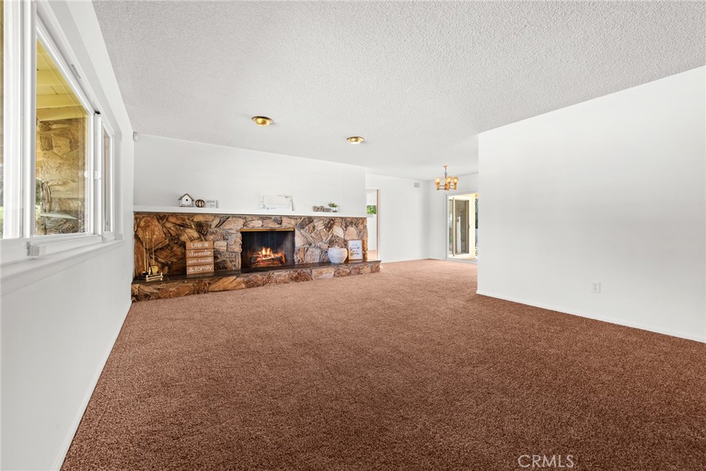 5593 Malvern Way Riverside, CA 92506 - Photo 2 of 54 a view of a livingroom with furniture and a fireplace