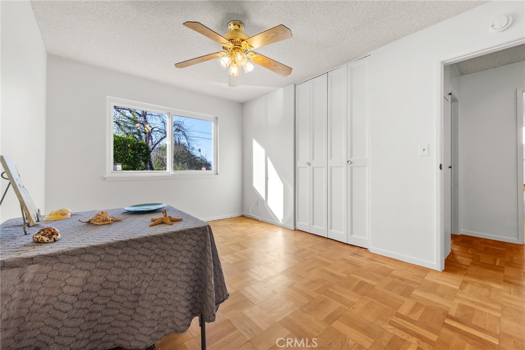 5593 Malvern Way Riverside, CA 92506 - Photo 21 of 54 a view of room with window and wooden floor