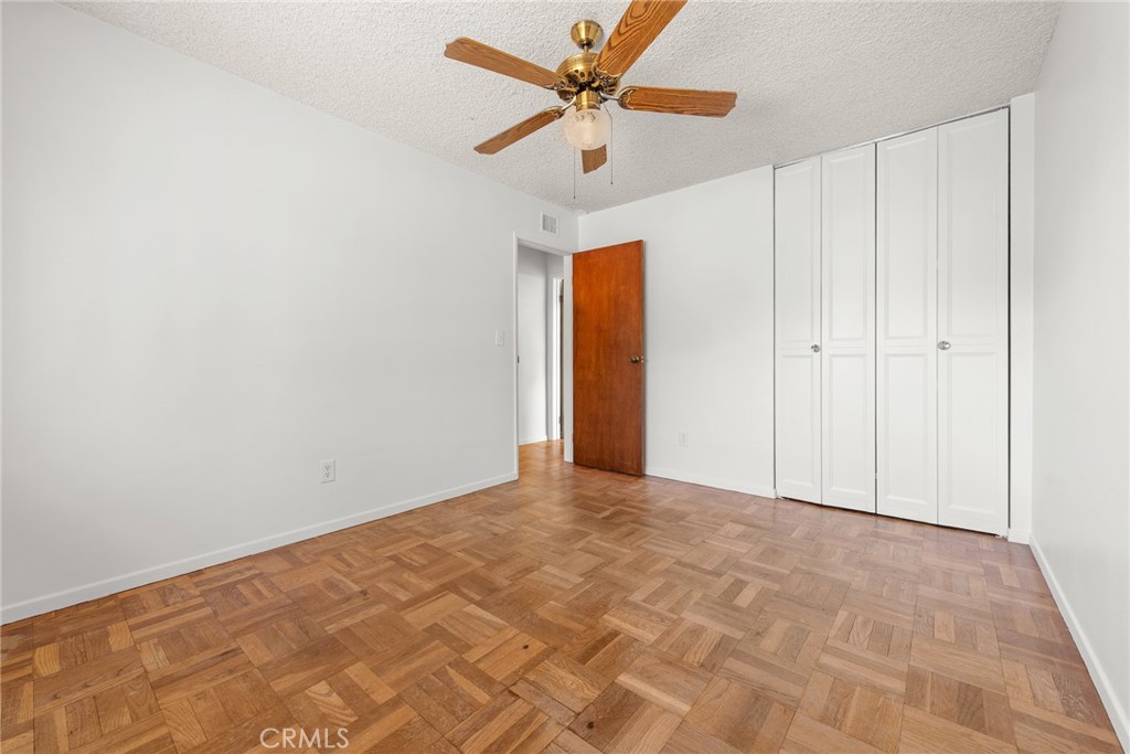 5593 Malvern Way Riverside, CA 92506 - Photo 22 of 54 a view of a room with a ceiling fan and a window