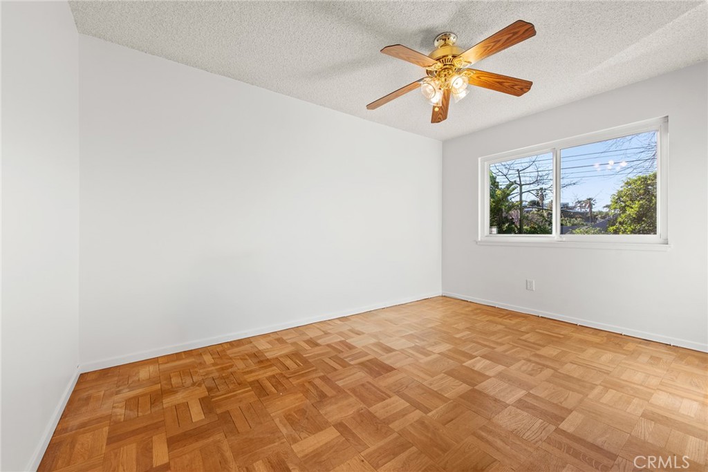5593 Malvern Way Riverside, CA 92506 - Photo 23 of 54 a view of a big room with windows and chandelier fan