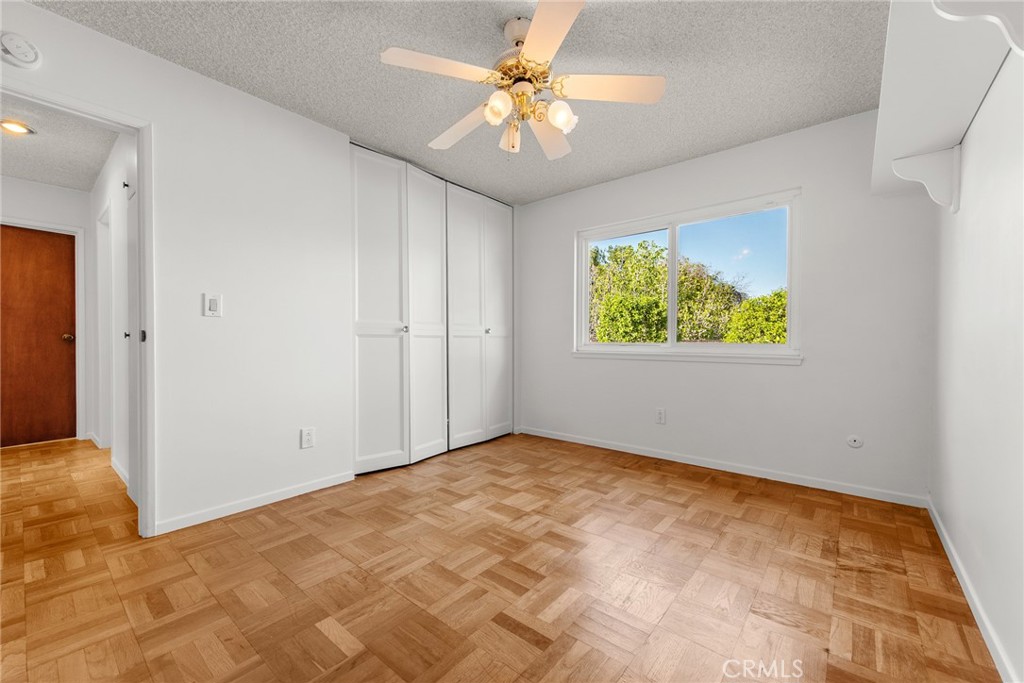 5593 Malvern Way Riverside, CA 92506 - Photo 25 of 54 a view of room with window and ceiling fan