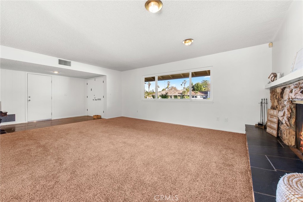 5593 Malvern Way Riverside, CA 92506 - Photo 3 of 54 a view of a livingroom with furniture and a ceiling fan
