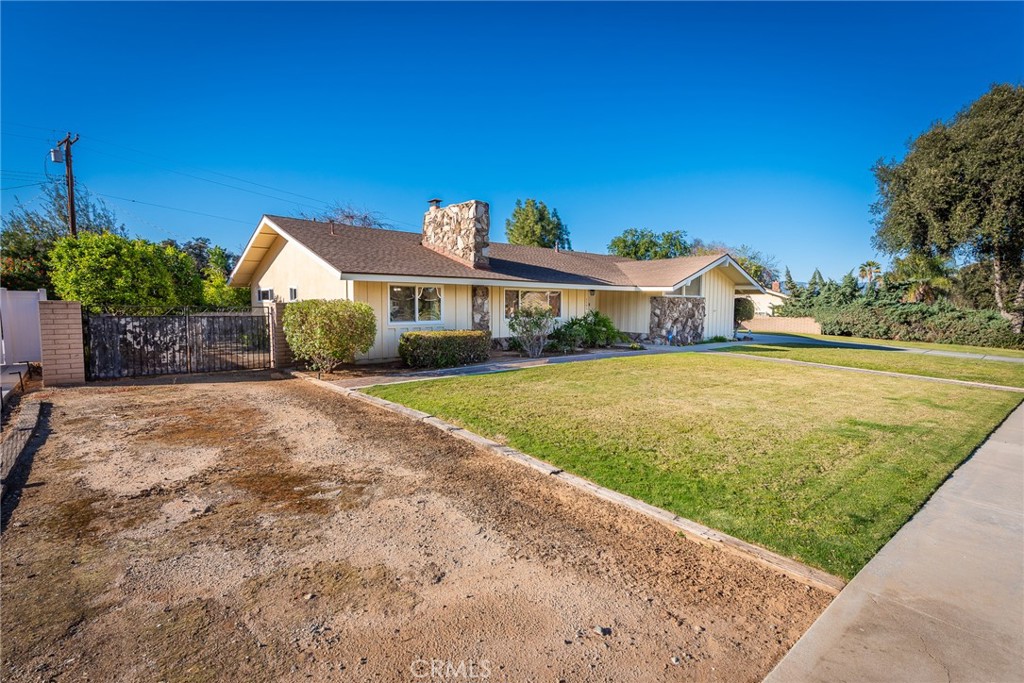 5593 Malvern Way Riverside, CA 92506 - Photo 34 of 54 a view of a house with a yard