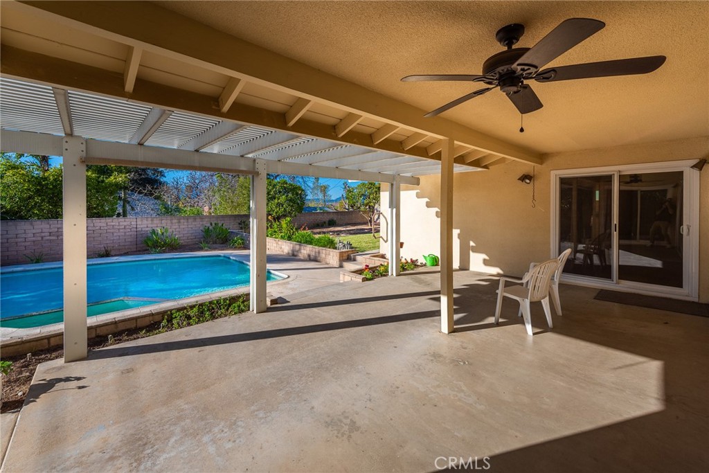 5593 Malvern Way Riverside, CA 92506 - Photo 36 of 54 a view of a patio with a table and chairs