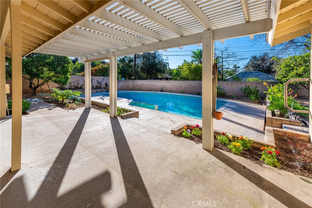 5593 Malvern Way Riverside, CA 92506 - Photo 43 of 54 a view of a patio with table and chairs potted plants