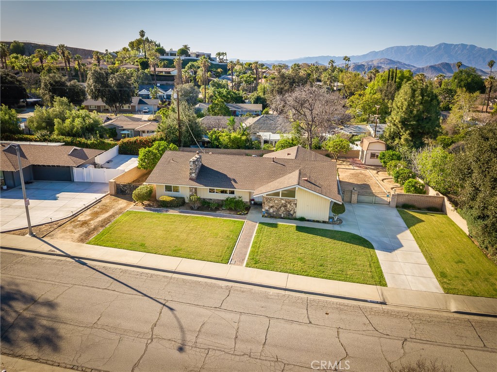 5593 Malvern Way Riverside, CA 92506 - Photo 45 of 54 a view of a swimming pool with a lawn chairs