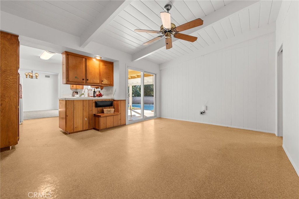 5593 Malvern Way Riverside, CA 92506 - Photo 10 of 54 a view of a livingroom with furniture a ceiling fan and window