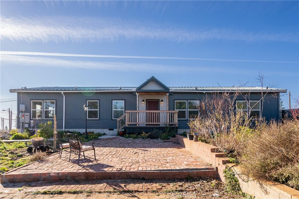 1383 Elliott Road Paradise, CA 95969 - Photo 1 of 1 a front view of a house with garden