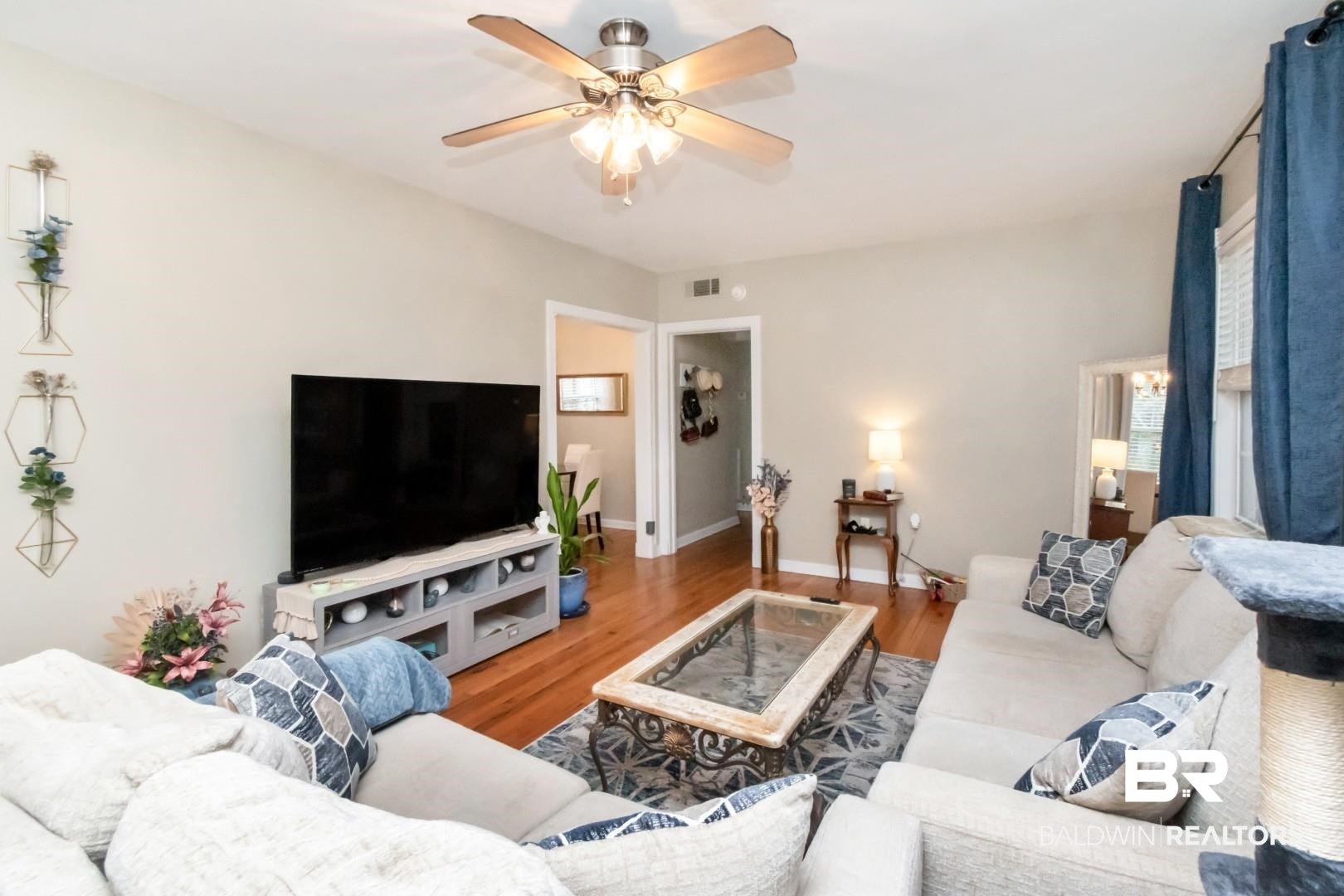 214 Upham Street, Unit 17C Mobile, AL 36607 - Photo 13 of 32 Living room with wood finished floors and a ceiling fan
