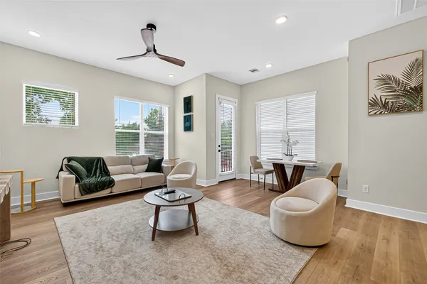 a living room with furniture and a large window
