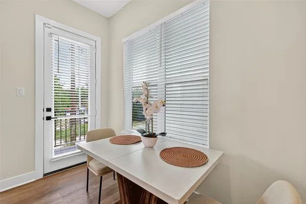 a dining room with a table and chairs