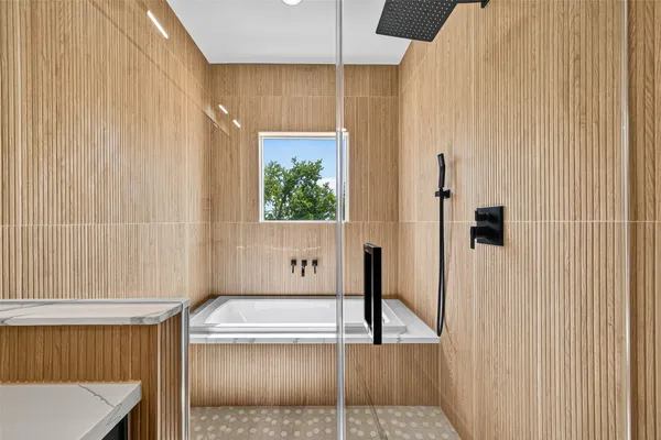 a view of a bedroom with a bed and a window