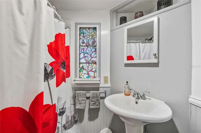 a bathroom with a sink and a mirror