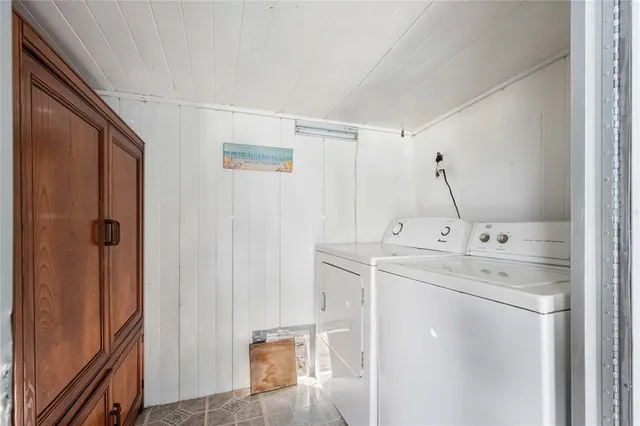 a view of a bathroom with a sink mirror and shower
